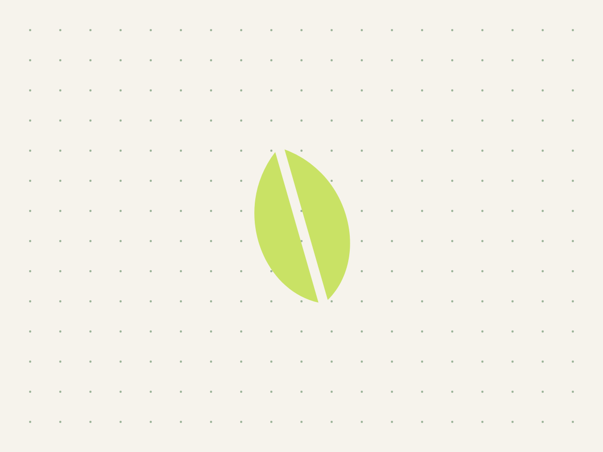 A single shoot-green leaf on a quiet dotted linen grid